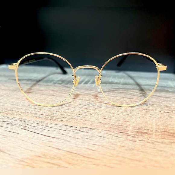 Gucci glasses frames; Unisex; Black and gold